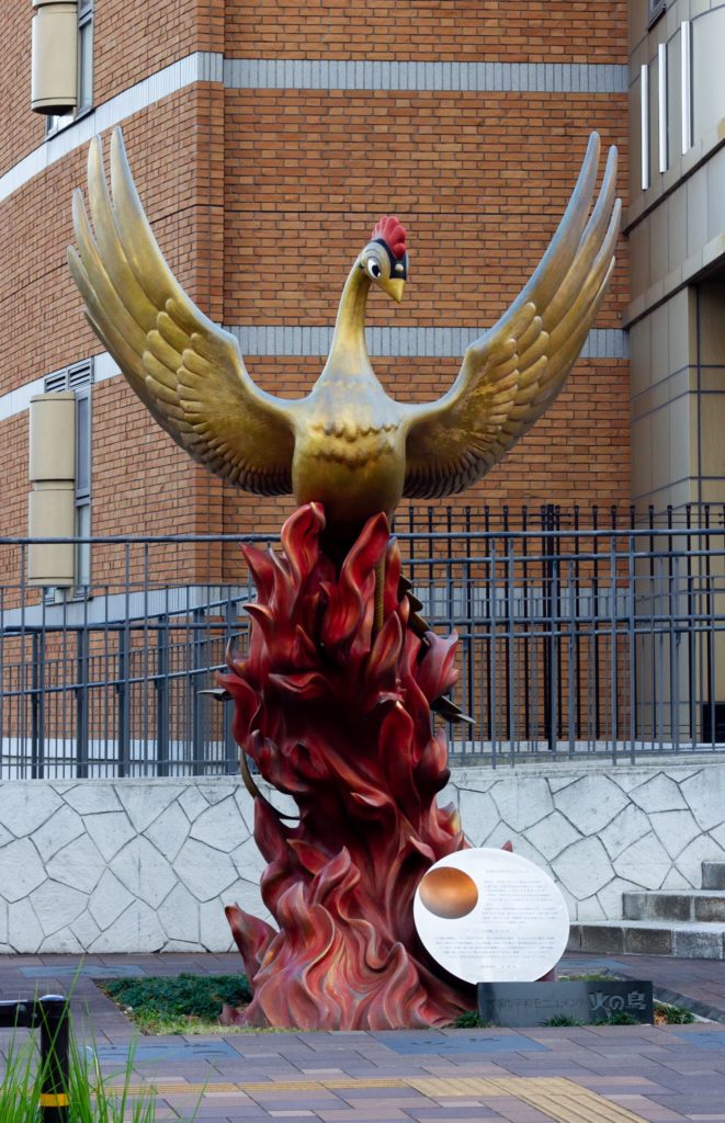 A large statue of a golden bird.